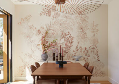 dining room with artistic pendant light fixture and botanical wall art