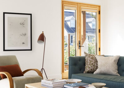 living room featuring french doors with natural wood trim