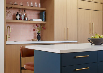 kitchen floor to ceiling cabinetry, wet bar, and island